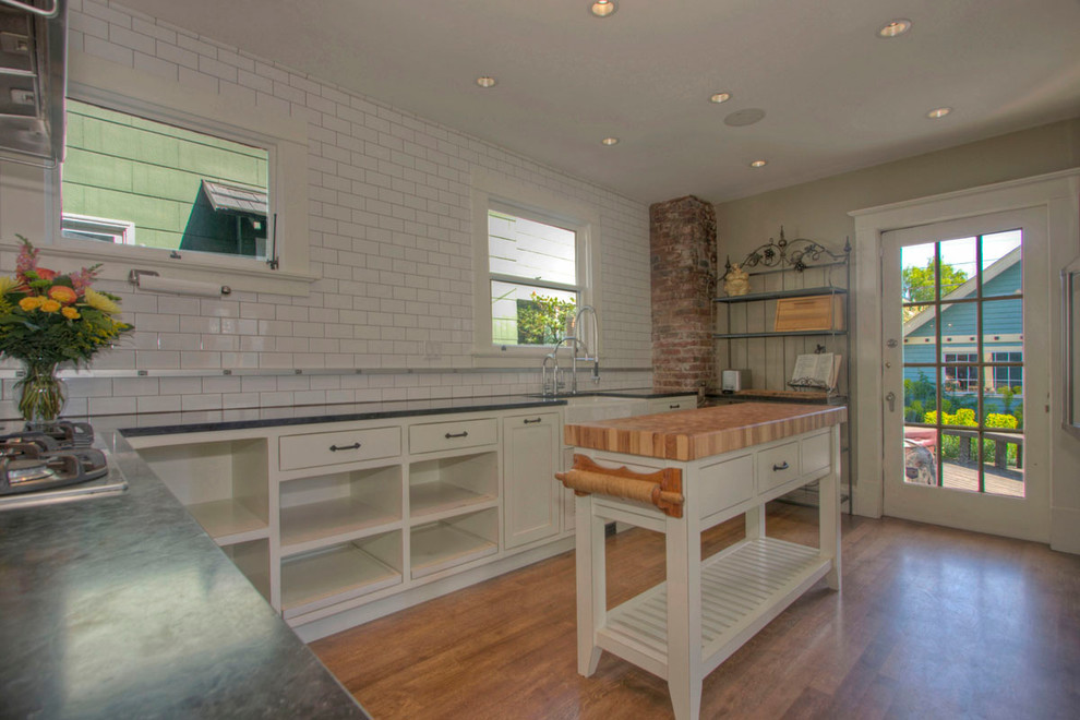 This is an example of a mid-sized country kitchen in Seattle.