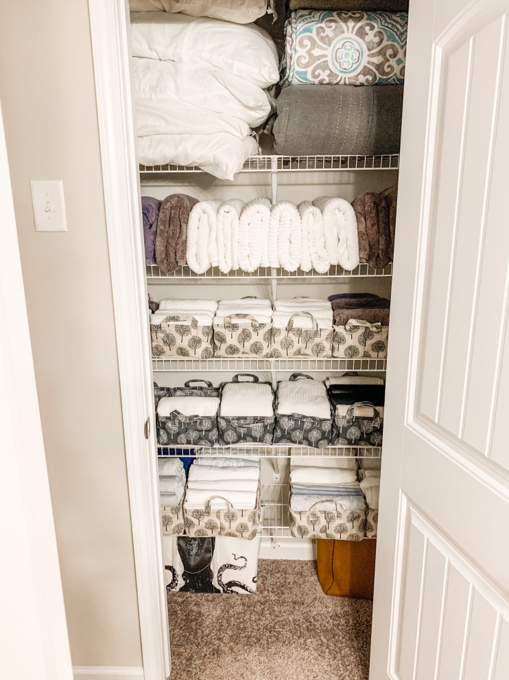 This is an example of a small traditional gender-neutral storage and wardrobe in Atlanta.