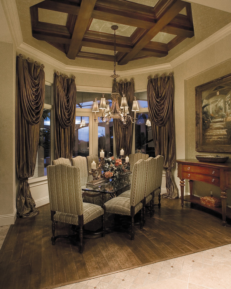 Large mediterranean separate dining room in Miami with beige walls, dark hardwood floors and no fireplace.