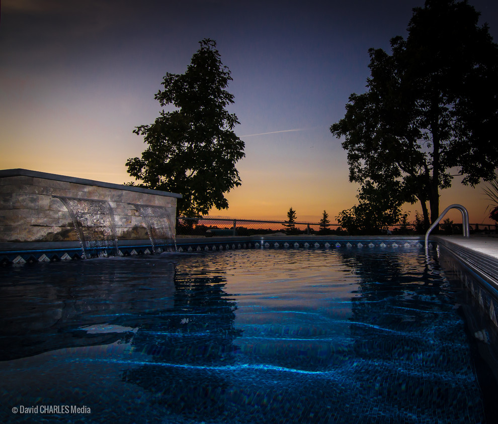 Pool fountain - small transitional backyard concrete and rectangular pool fountain idea in Toronto