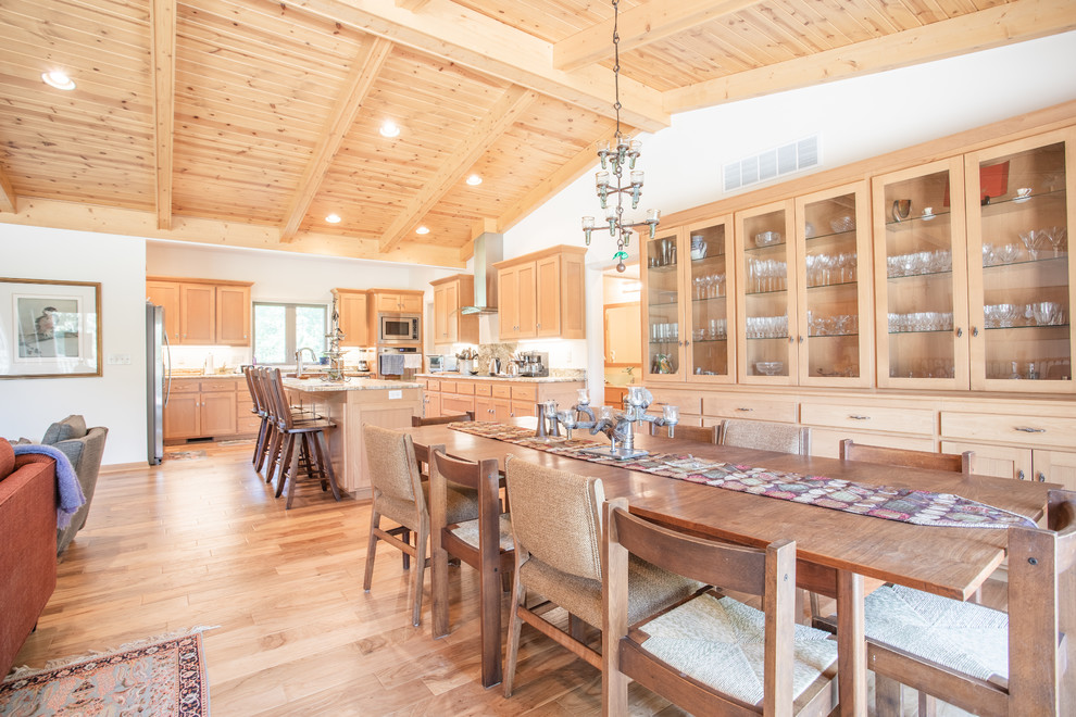 Great room - large transitional light wood floor and beige floor great room idea