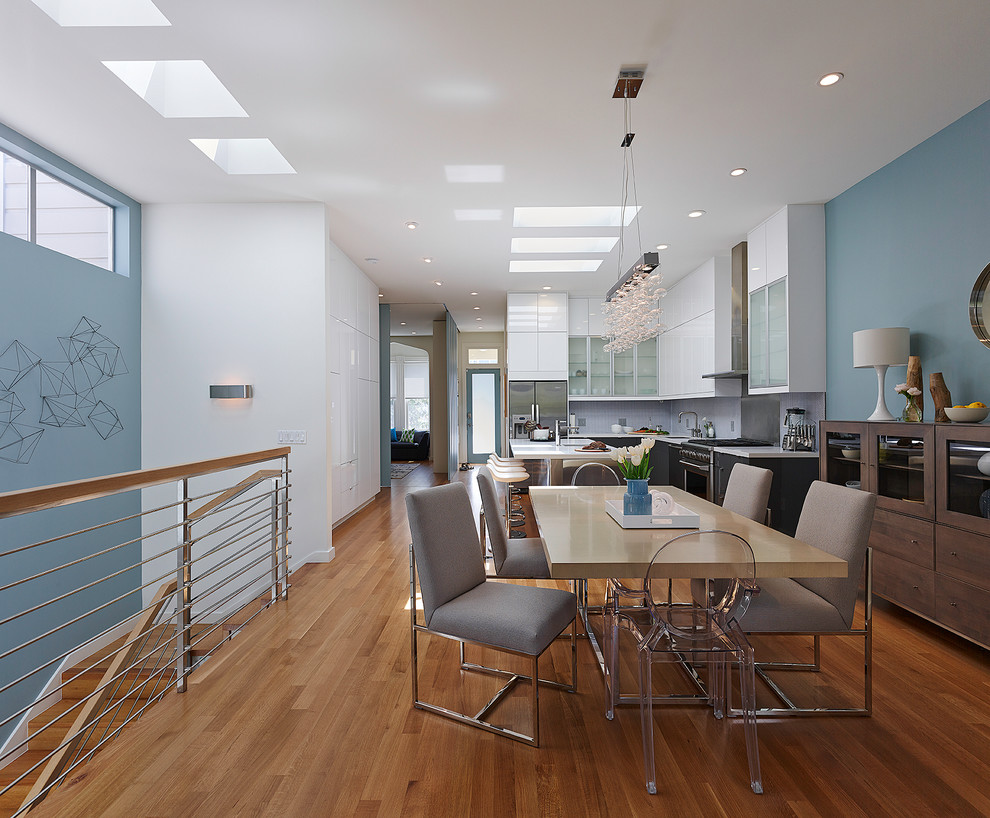 This is an example of a contemporary open plan dining in San Francisco with grey walls.