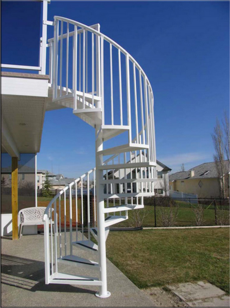 Example of a large transitional spiral staircase design in Calgary
