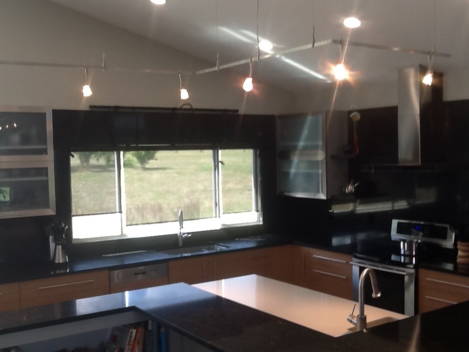 Eat-in kitchen - slate floor eat-in kitchen idea with an undermount sink, granite countertops and stainless steel appliances