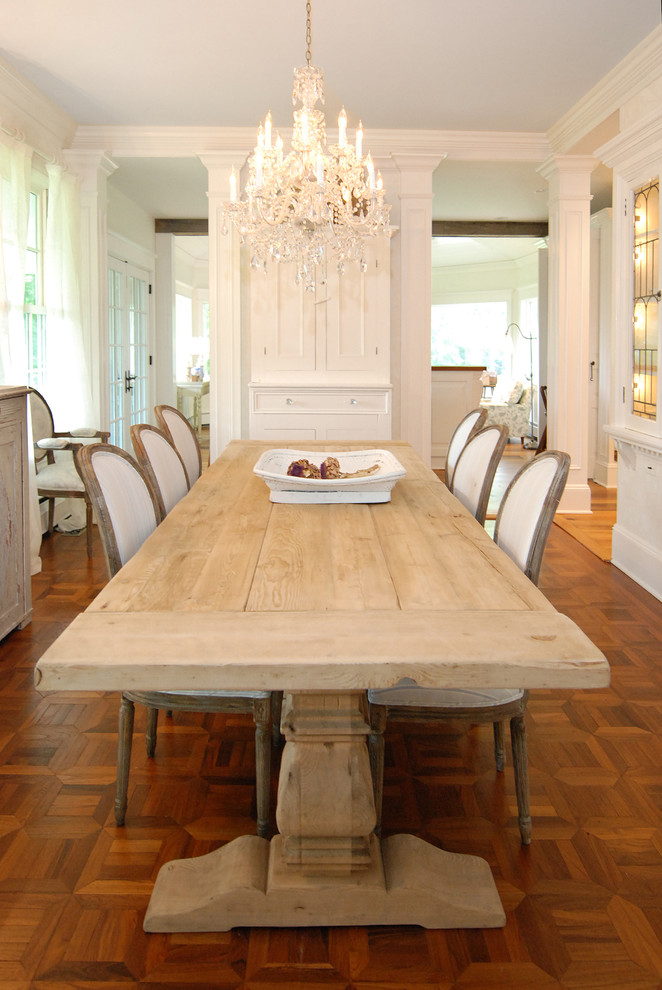 Inspiration for a traditional dining room in New York with medium hardwood floors and brown floor.