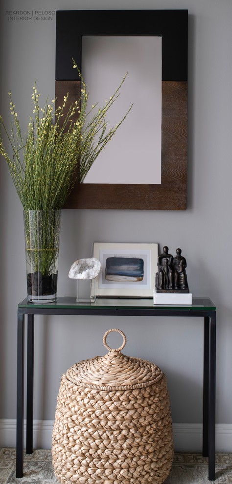 Example of a small transitional ceramic tile and gray floor foyer design with gray walls