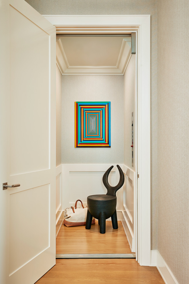 Photo of a mid-sized contemporary hallway in San Francisco with beige walls and medium hardwood floors.