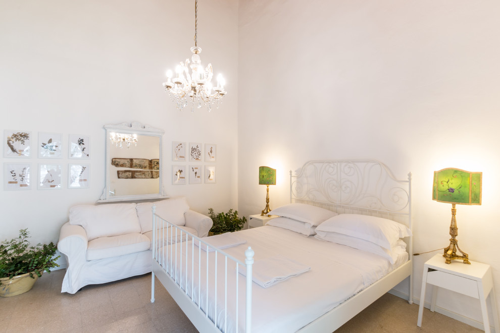 Photo of a large country master bedroom in Catania-Palermo with white walls.