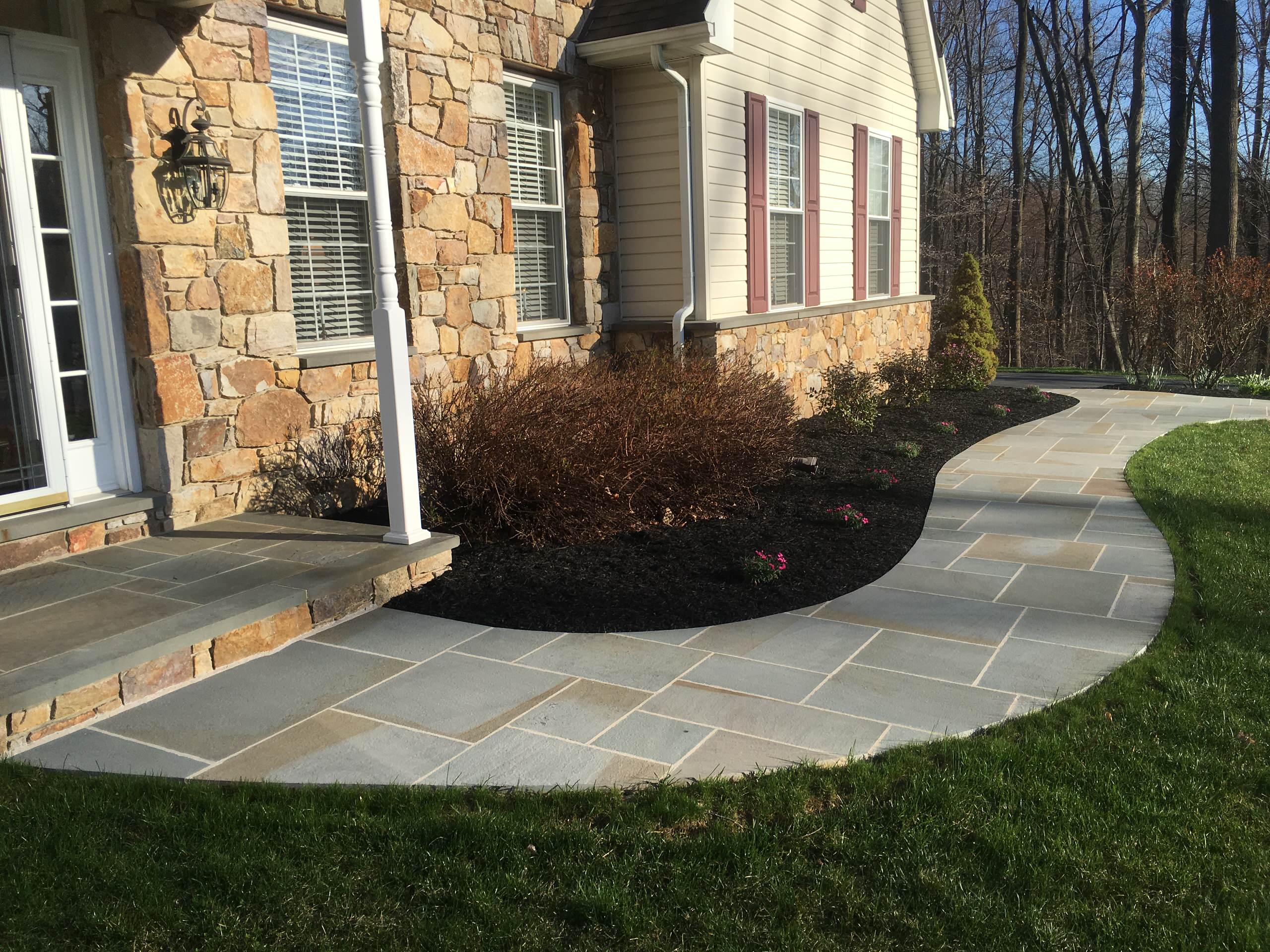 Walkway, porch and stone facade