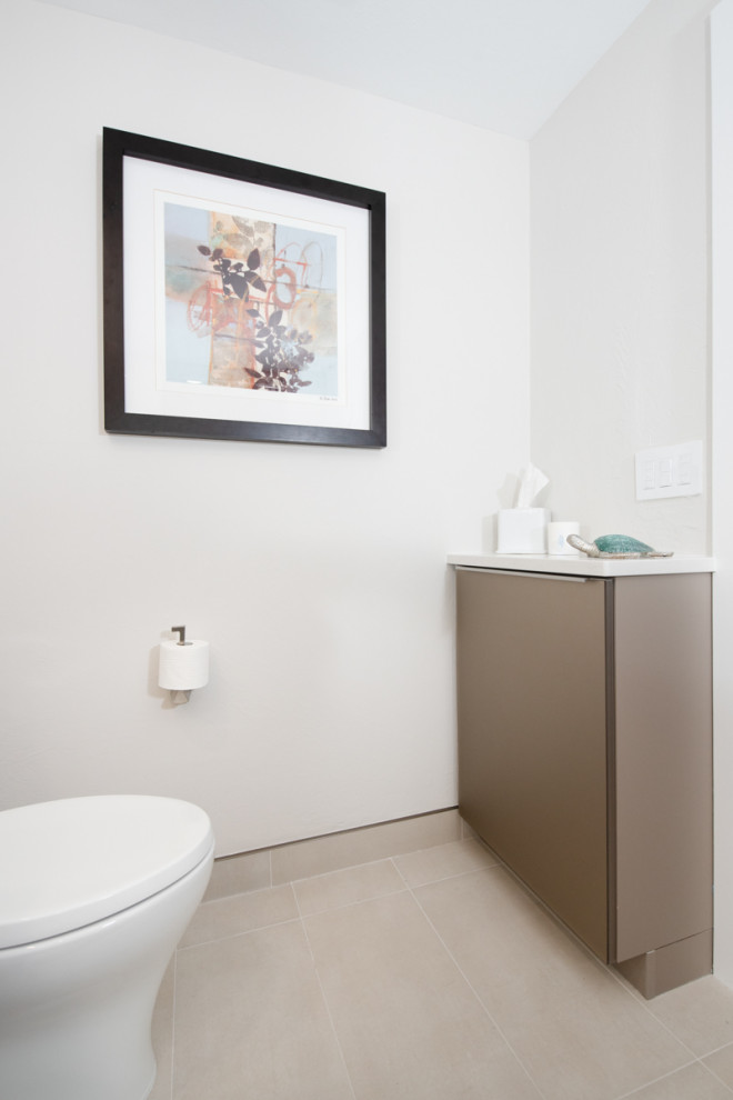 Design ideas for a mid-sized contemporary powder room in Miami with flat-panel cabinets, brown cabinets, beige tile, porcelain tile, engineered quartz benchtops, white benchtops and a freestanding vanity.