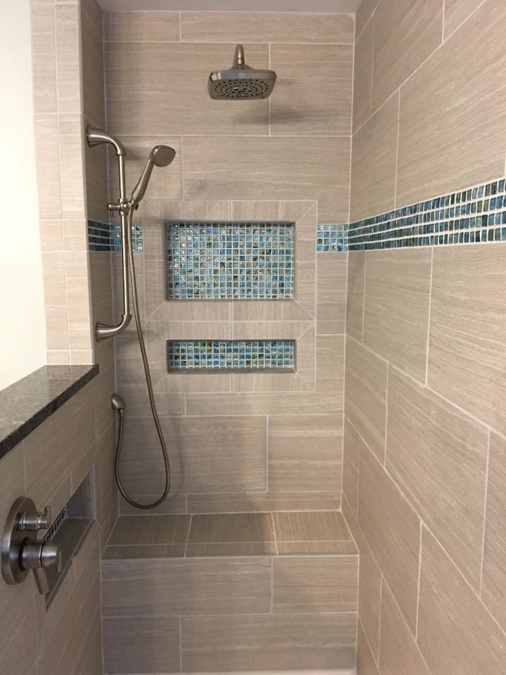 This is an example of a mid-sized contemporary master bathroom in St Louis with recessed-panel cabinets, beige cabinets, a drop-in tub, a corner shower, a two-piece toilet, beige tile, blue tile, porcelain tile, beige walls, porcelain floors, an undermount sink, granite benchtops, beige floor, a hinged shower door and black benchtops.