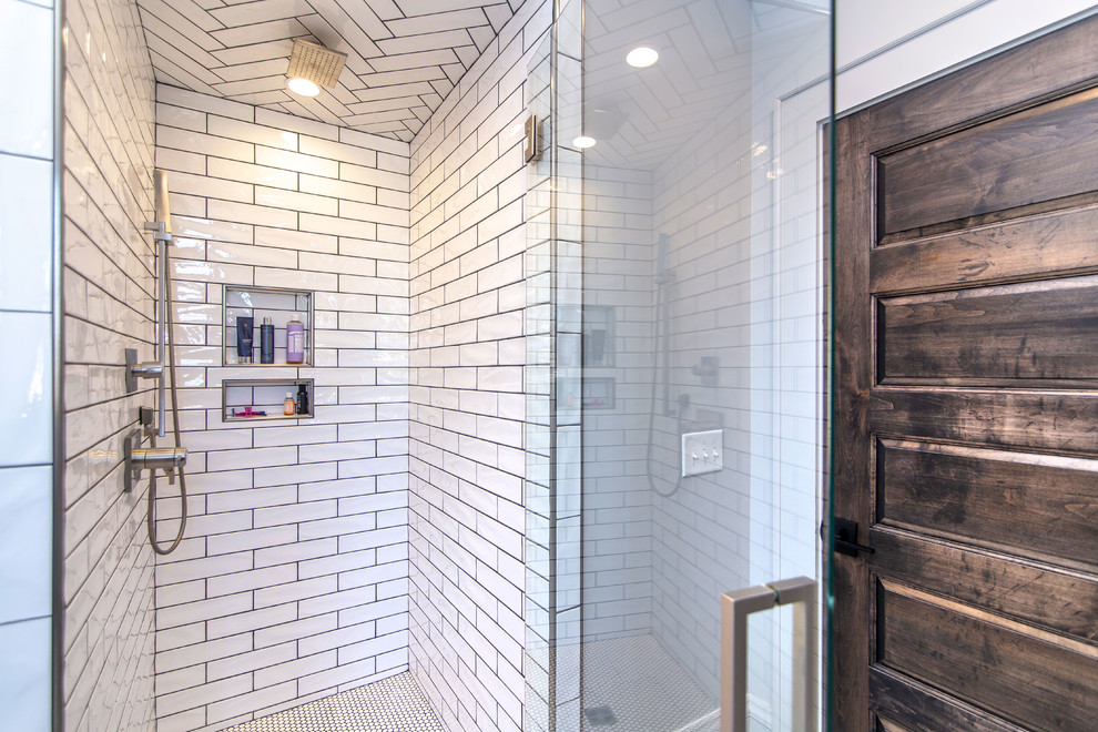 This is an example of a mid-sized industrial bathroom in Charlotte with open cabinets, medium wood cabinets, a corner shower, white tile, subway tile, white walls, ceramic floors, a vessel sink, engineered quartz benchtops, black floor and black benchtops.