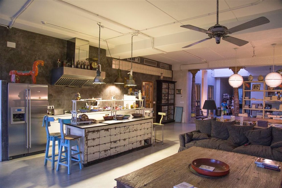 This is an example of a large eclectic single-wall open plan kitchen in Other with with island.