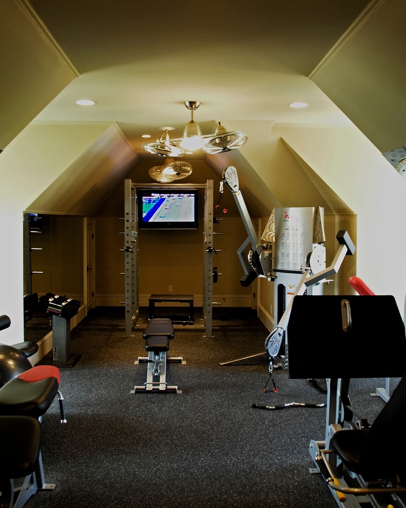 Inspiration for a mid-sized modern home weight room in Charlotte with beige walls and cork floors.