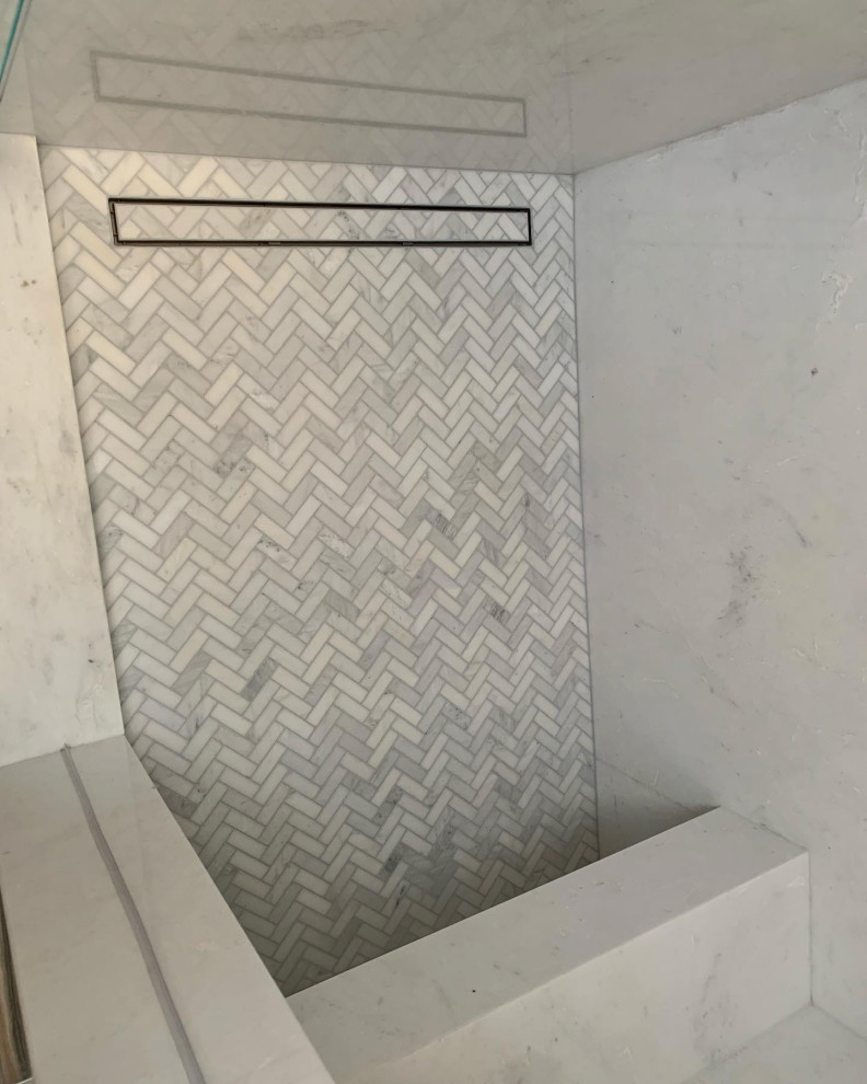 Inspiration for a mid-sized modern master white tile and marble tile light wood floor shower bench remodel in Orange County with white walls, marble countertops, a hinged shower door and white countertops