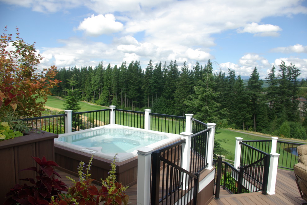 Example of a transitional backyard balcony deck design in Seattle with no cover