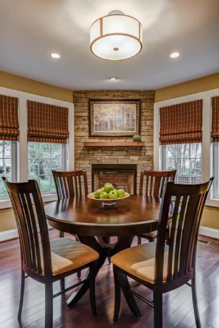 Example of a mid-sized transitional u-shaped dark wood floor open concept kitchen design in DC Metro with recessed-panel cabinets, medium tone wood cabinets and an island