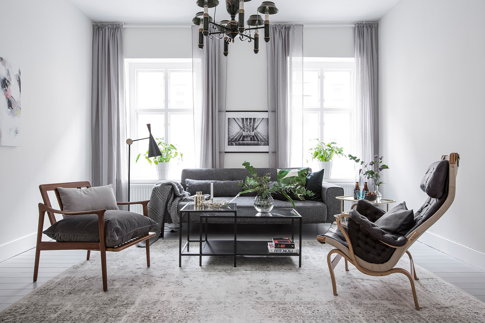 Foto på ett mellanstort minimalistiskt separat vardagsrum, med ett finrum, vita väggar, målat trägolv och vitt golv