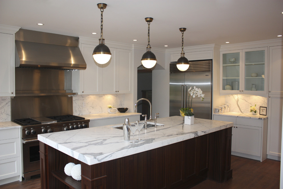 Design ideas for a contemporary kitchen in Vancouver with stainless steel appliances and marble splashback.
