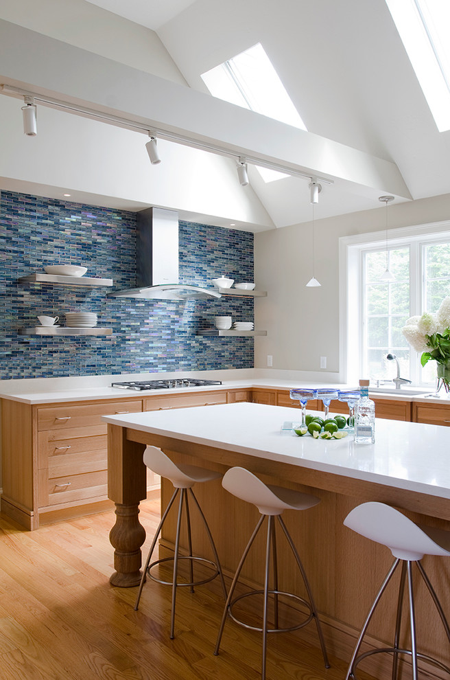 This is an example of a contemporary kitchen in Boston with an undermount sink, shaker cabinets, medium wood cabinets, blue splashback, matchstick tile splashback, medium hardwood floors and with island.