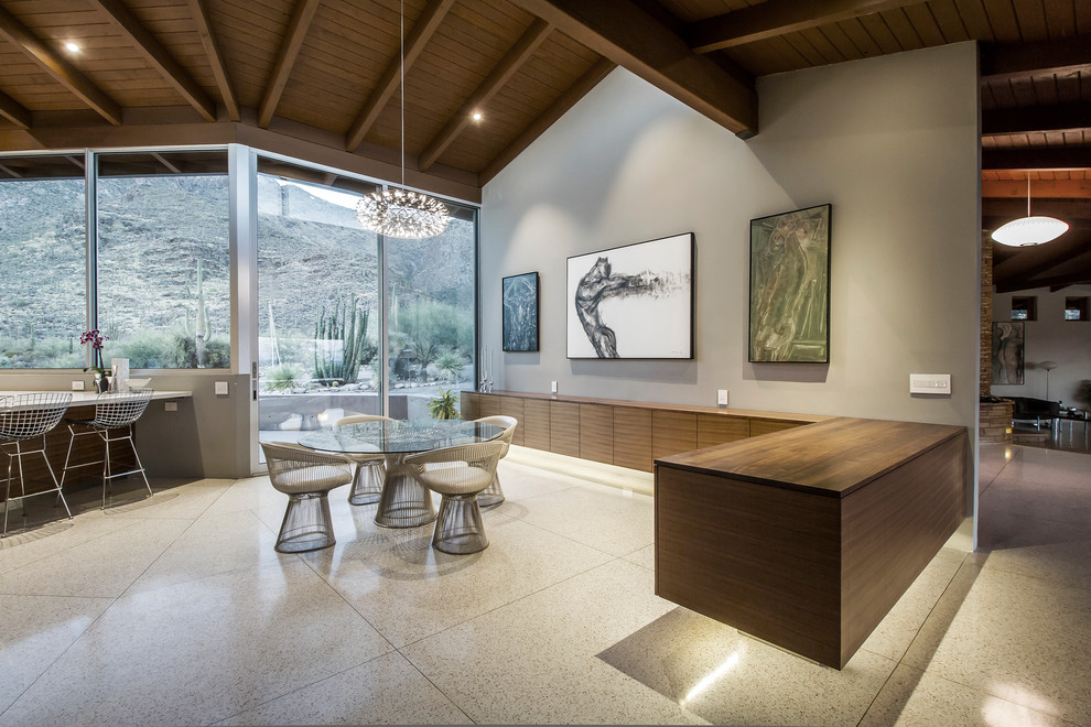 This is an example of a large modern u-shaped eat-in kitchen in Phoenix with an undermount sink, flat-panel cabinets, brown cabinets, quartz benchtops, panelled appliances, terrazzo floors, with island and white floor.