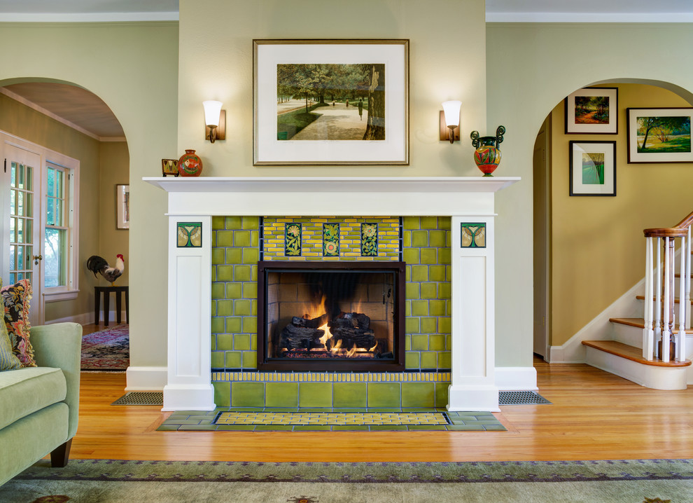 Example of an arts and crafts living room design in Detroit with a standard fireplace and a tile fireplace