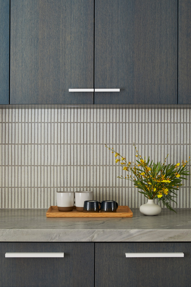 Wet bar - small contemporary single-wall light wood floor and brown floor wet bar idea in San Francisco with an undermount sink, flat-panel cabinets, dark wood cabinets, quartzite countertops, white backsplash, mosaic tile backsplash and gray countertops