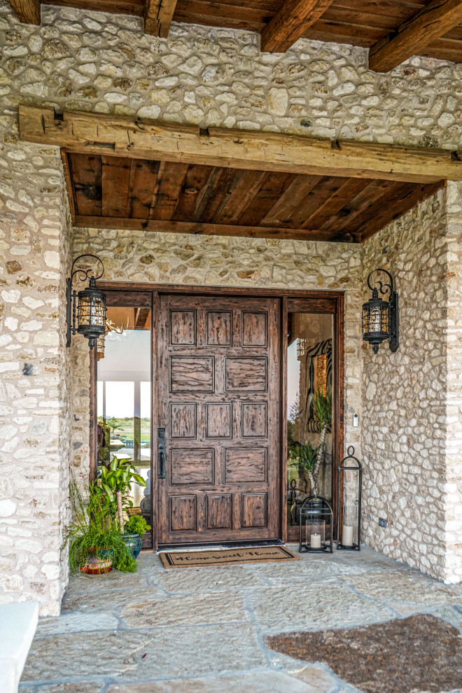 Inspiration for a rustic entryway remodel in Austin