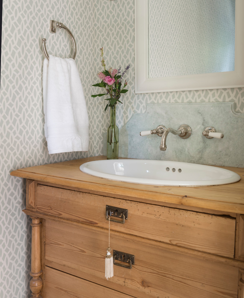 Powder room - coastal powder room idea in Providence with a drop-in sink, furniture-like cabinets and multicolored walls