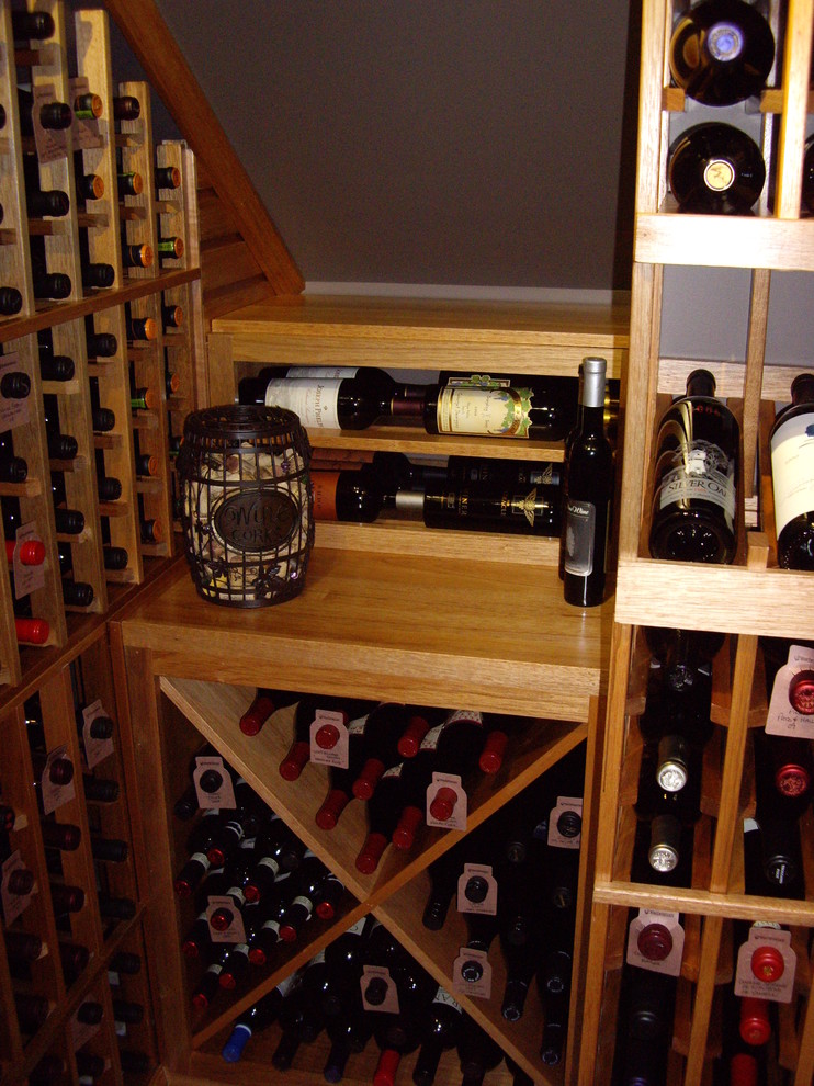 Mid-sized traditional wine cellar in Dallas with storage racks.