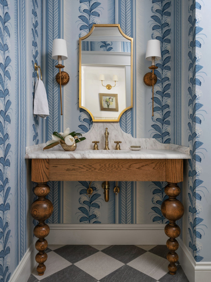 Example of a classic multicolored floor and wallpaper powder room design in Atlanta with a built-in vanity