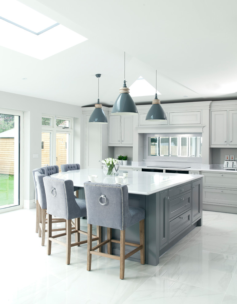 Inspiration for a transitional kitchen in Other with recessed-panel cabinets, grey cabinets, mirror splashback, with island, grey floor and grey benchtop.
