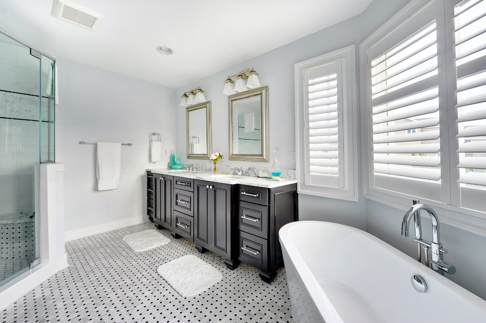 Design ideas for a transitional bathroom in Philadelphia with a freestanding tub.