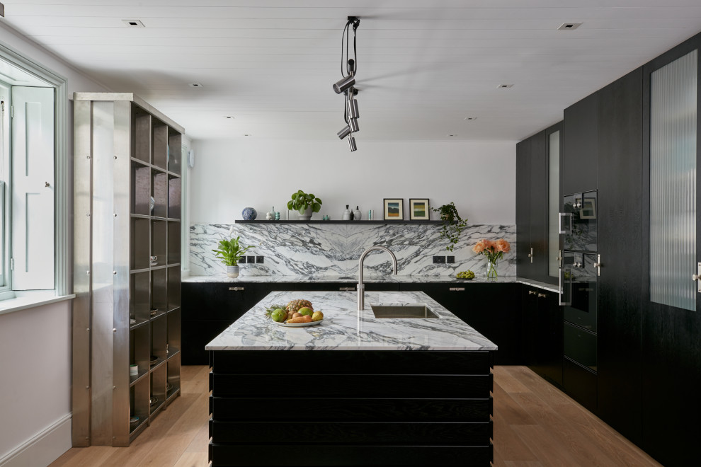 Design ideas for a large contemporary kitchen in London with flat-panel cabinets, black cabinets, marble worktops, multi-coloured splashback, marble splashback, an island and white worktops.