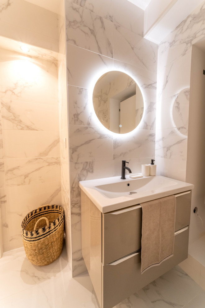 This is an example of a small contemporary shower room bathroom in Nice with beige cabinets, a corner shower, a wall mounted toilet, white tiles, ceramic tiles, white walls, ceramic flooring, a submerged sink, white floors, a sliding door, white worktops, a single sink and a floating vanity unit.