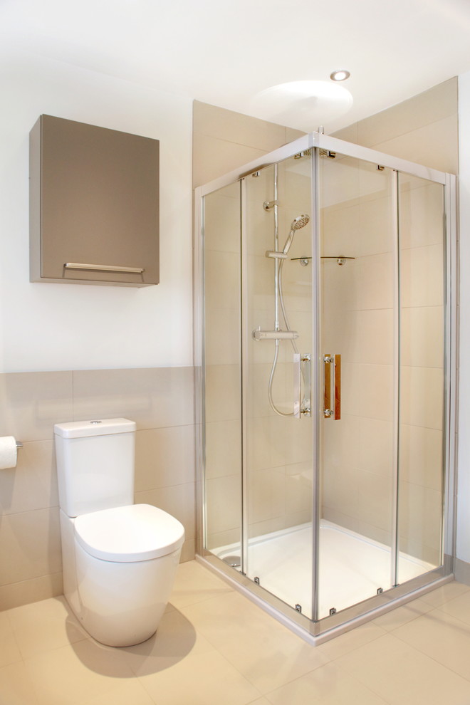 Design ideas for a mid-sized contemporary kids bathroom in Buckinghamshire with flat-panel cabinets, beige cabinets, a corner shower, white walls and porcelain floors.