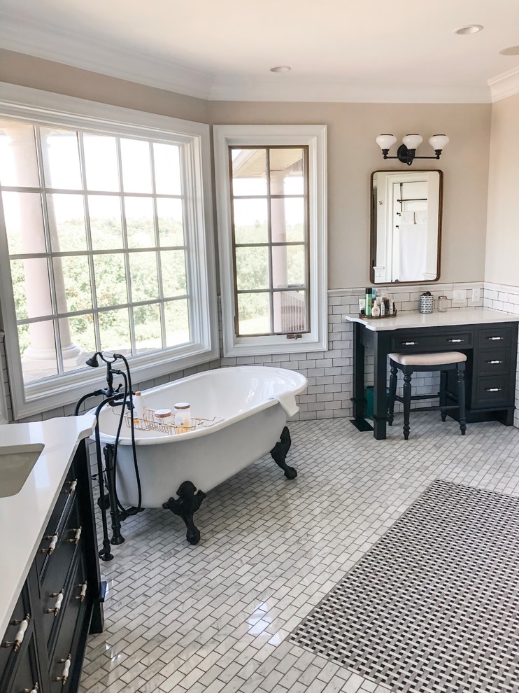 Design ideas for a mid-sized transitional master bathroom in Philadelphia with recessed-panel cabinets, black cabinets, a freestanding tub, a corner shower, a two-piece toilet, white tile, subway tile, beige walls, mosaic tile floors, an undermount sink, engineered quartz benchtops, white floor, an open shower and white benchtops.
