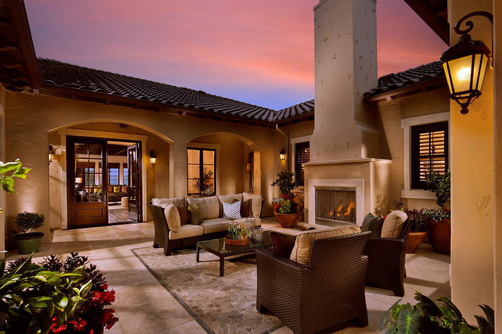 Inspiration for a mediterranean patio in San Francisco with no cover and with fireplace.