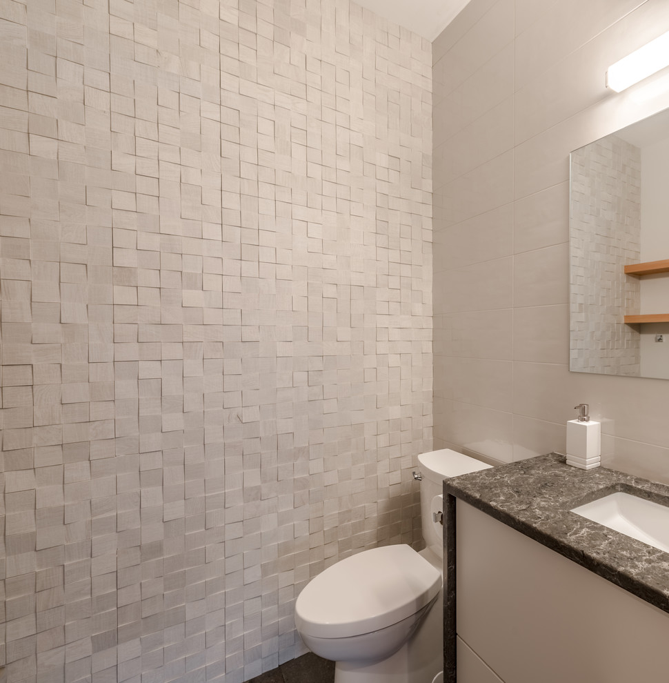 Small contemporary bathroom in Other with flat-panel cabinets, white cabinets, a one-piece toilet, white tile, ceramic tile, white walls, ceramic floors, an undermount sink, engineered quartz benchtops, grey floor, a hinged shower door and grey benchtops.