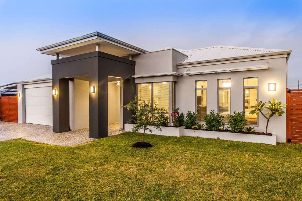 Inspiration for a contemporary one-storey stucco beige exterior in Perth with a hip roof.