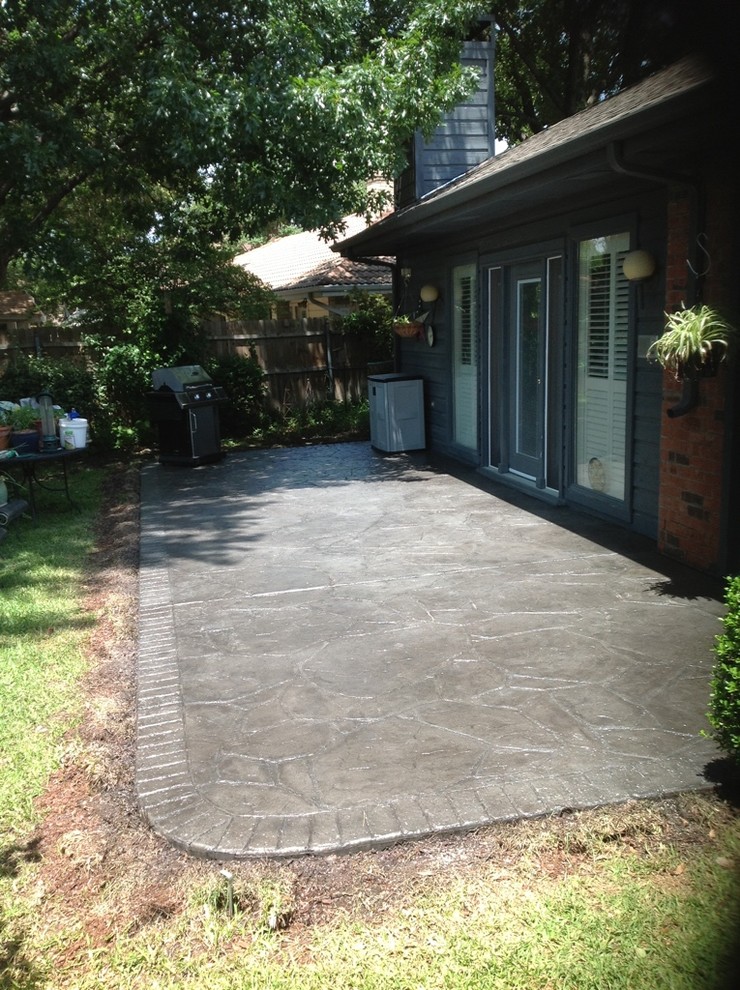Design ideas for a mid-sized traditional backyard patio in Dallas with tile and no cover.