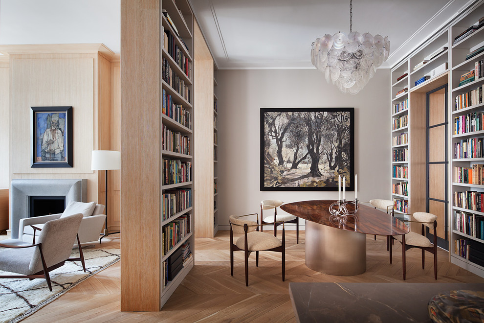 This is an example of a contemporary dining room in New York with grey walls, medium hardwood floors and brown floor.