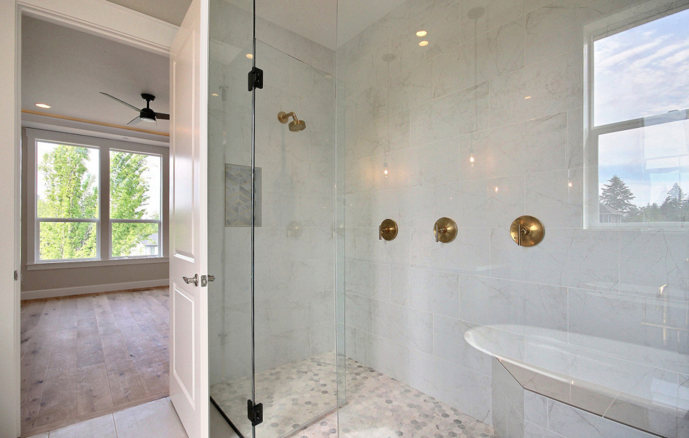 Design ideas for a large transitional master bathroom in Portland with recessed-panel cabinets, brown cabinets, a freestanding tub, a curbless shower, a one-piece toilet, gray tile, ceramic tile, beige walls, ceramic floors, an undermount sink, engineered quartz benchtops, grey floor, a hinged shower door, white benchtops, a shower seat, a double vanity and a built-in vanity.