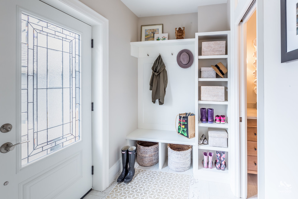 Small transitional mudroom in Toronto with grey walls and porcelain floors.