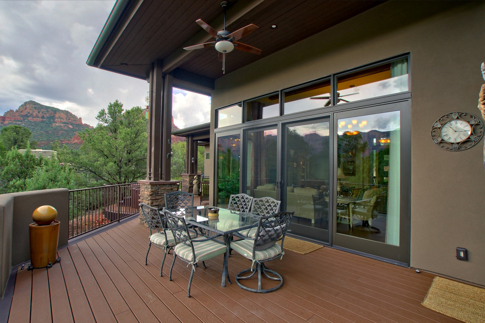 Design ideas for an arts and crafts backyard deck in Other with a roof extension.