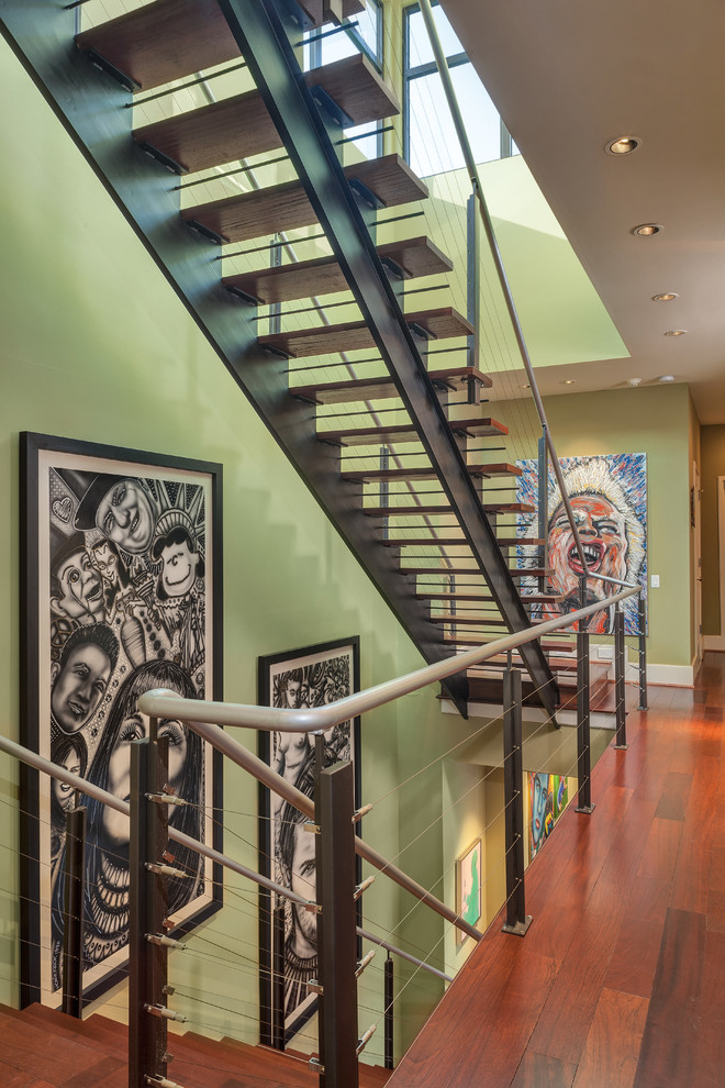 Design ideas for a contemporary wood straight staircase in Houston with open risers.