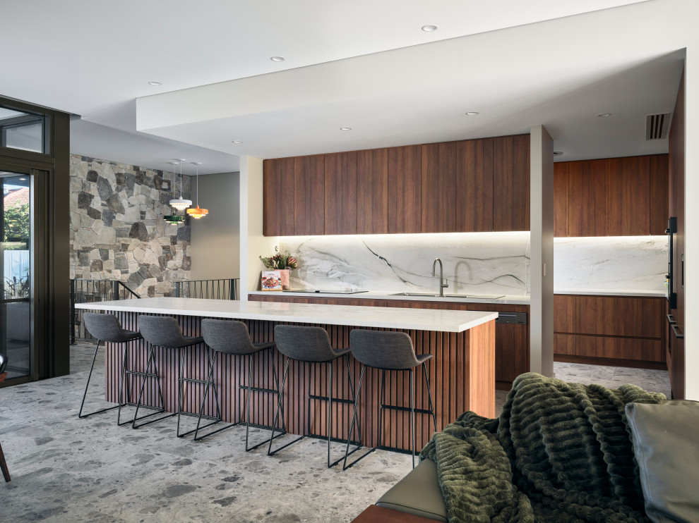 Midcentury u-shaped kitchen in Perth with an undermount sink, flat-panel cabinets, dark wood cabinets, white splashback, stone slab splashback, panelled appliances, with island, grey floor and white benchtop.