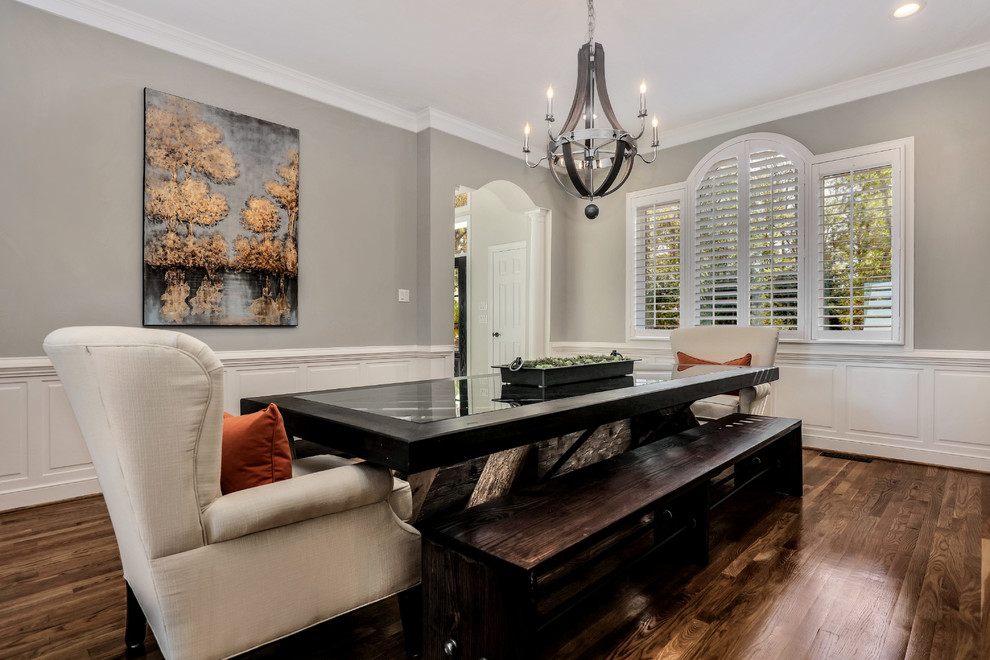 This is an example of a traditional separate dining room in Richmond with grey walls, dark hardwood floors and no fireplace.