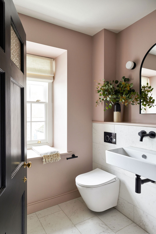 Inspiration for a mid-sized kids bathroom in Other with an alcove shower, multi-coloured tile, ceramic tile, pink walls, porcelain floors, a wall-mount sink, white floor, a hinged shower door and a single vanity.