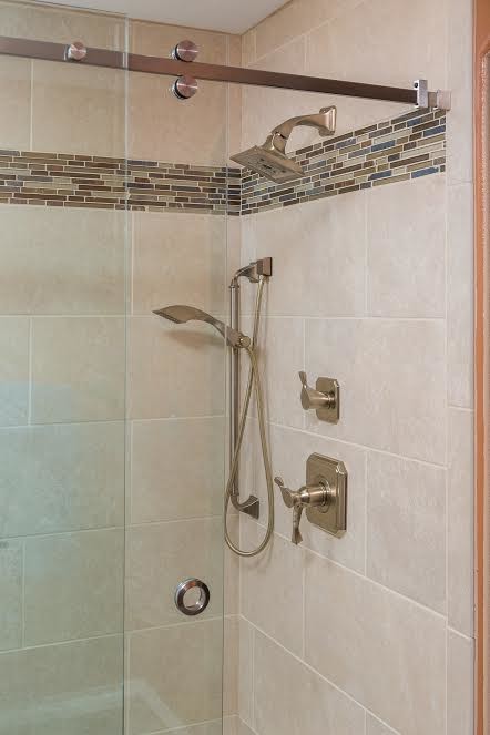 This is an example of a large traditional master bathroom in Other with raised-panel cabinets, medium wood cabinets, a curbless shower, beige tile, porcelain tile, orange walls, mosaic tile floors and engineered quartz benchtops.